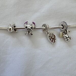 Four authentic and brand new Pandora charms